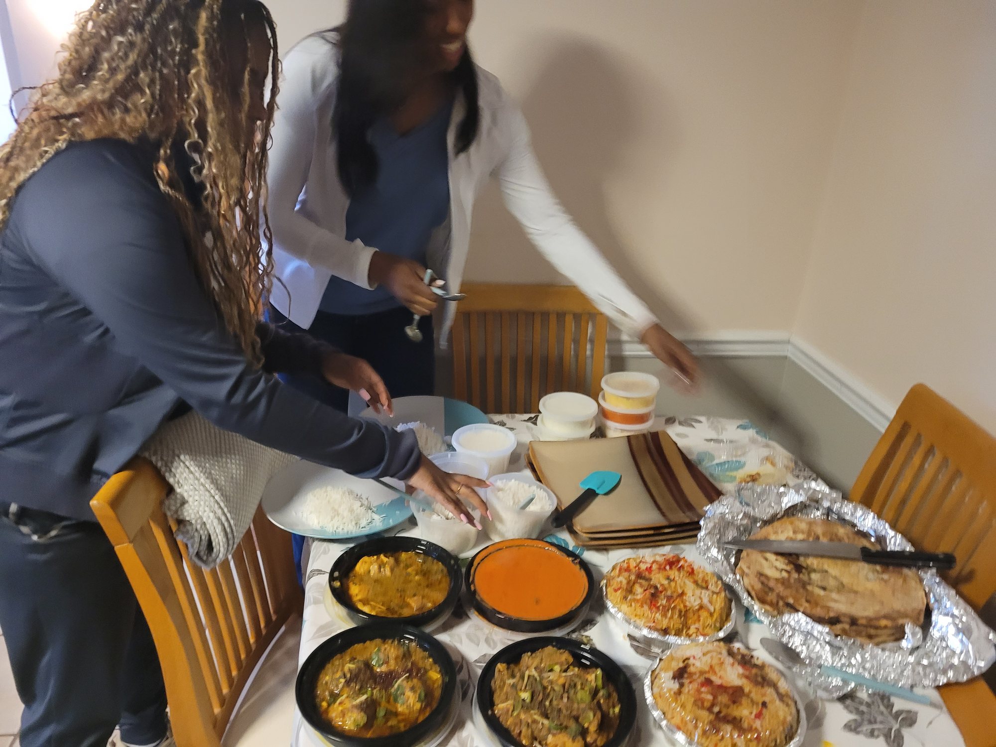 A real SMS Novel gathering — home-cooked dishes being served at a shared table